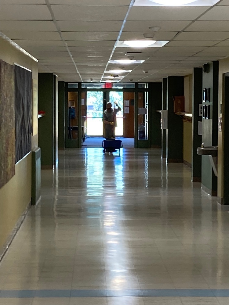 Mr. Cody working hard to makes our hallways shine!