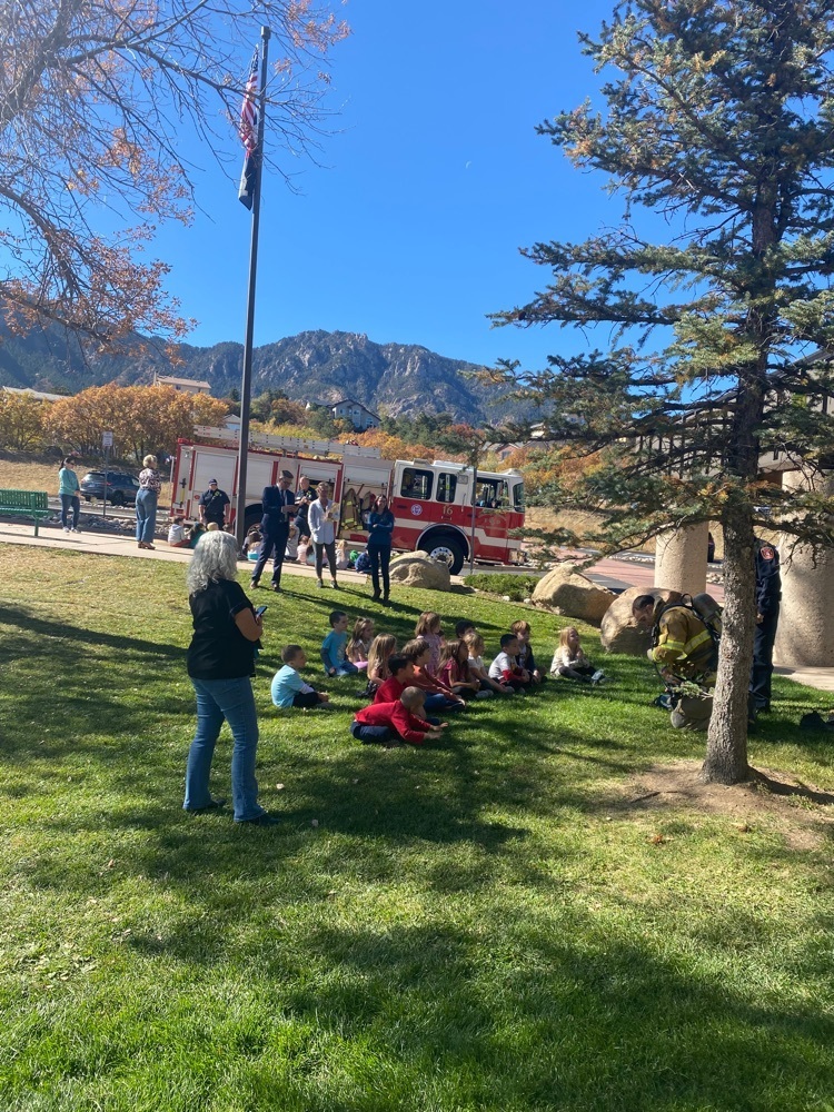 kindergarteners listening the the fireman 