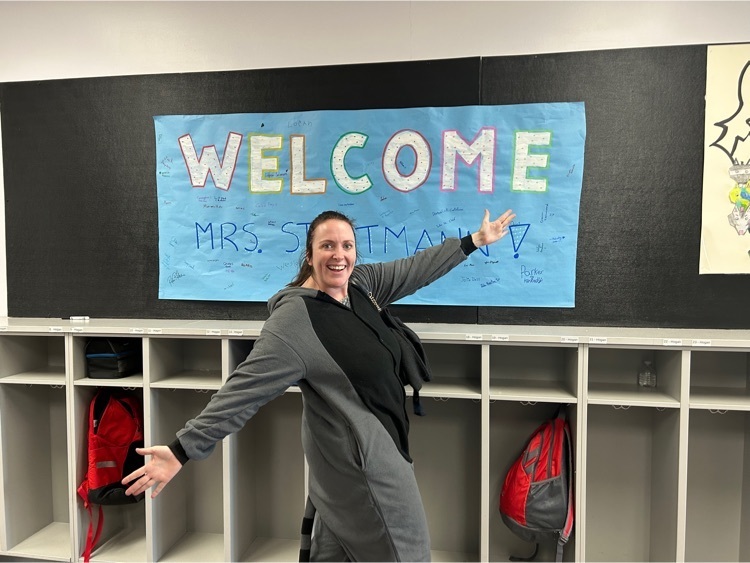 Our new fifth grade teacher, Mrs. Stratmann, excited about the welcome sign her new students made her!
